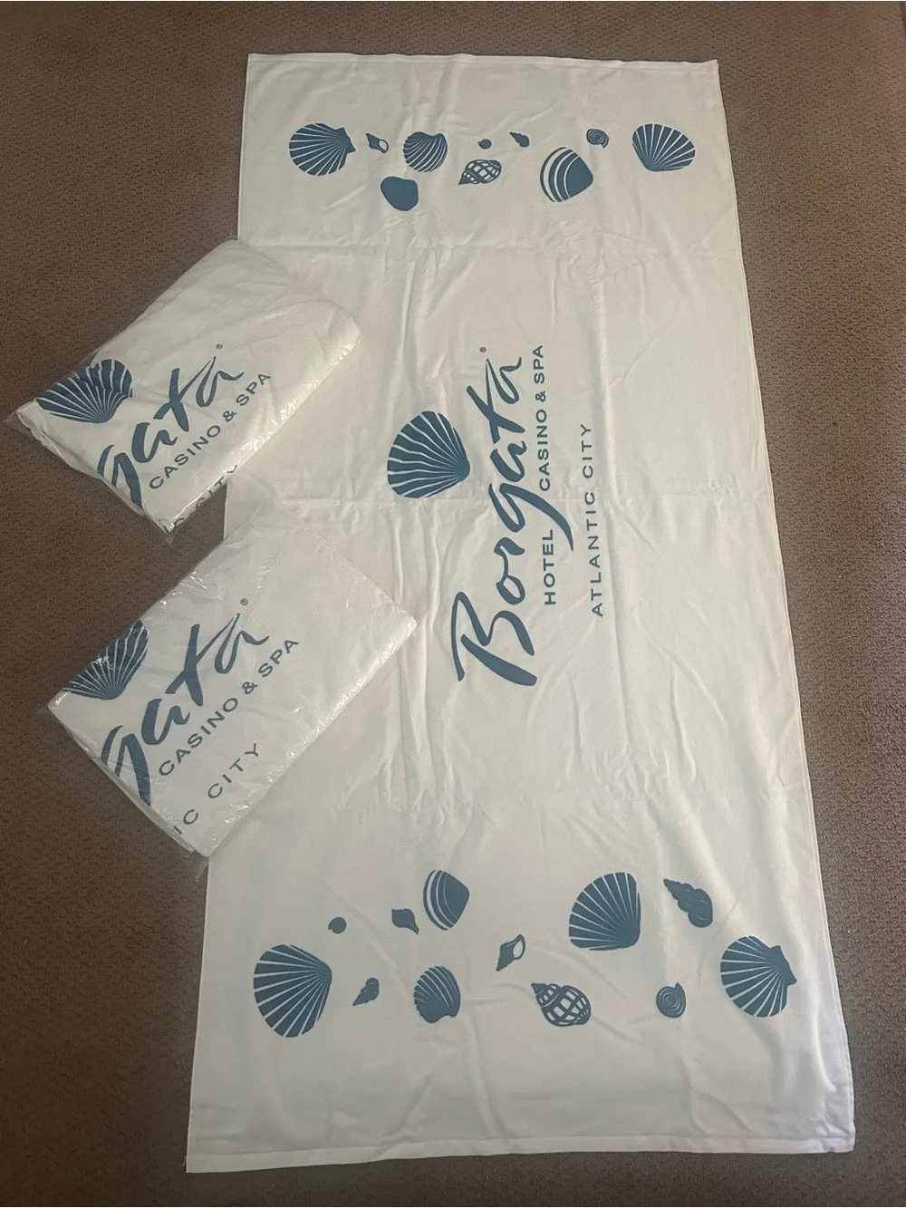 Borgata casino Atlantic City White Beach Towel with Blue Shell Motif